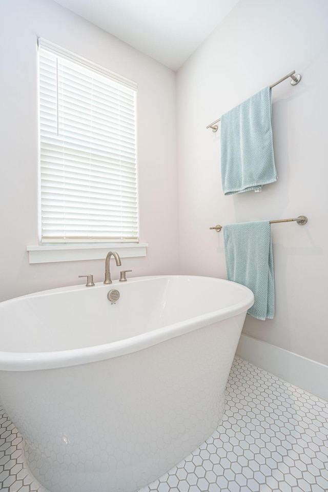 full bathroom with a freestanding bath