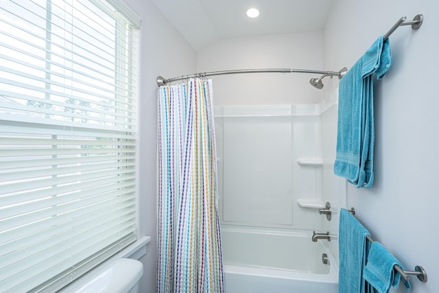full bathroom with toilet and shower / bath combo with shower curtain