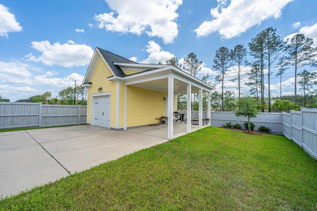 view of home's exterior with roof with shingles, a garage, a lawn, fence private yard, and driveway