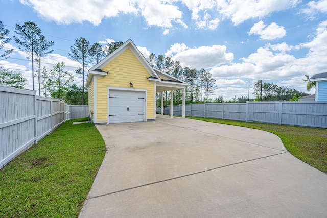 detached garage featuring fence and driveway