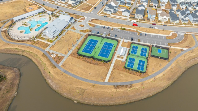 birds eye view of property featuring a residential view and a water view