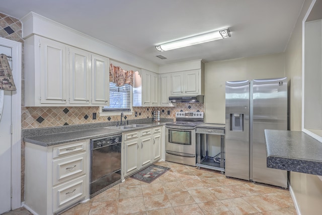 kitchen with sink, stainless steel appliances, light tile patterned floors, tasteful backsplash, and white cabinets