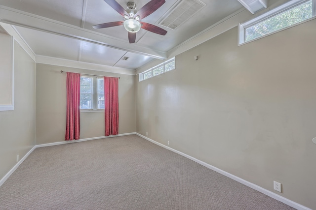 spare room featuring carpet floors, plenty of natural light, crown molding, and ceiling fan