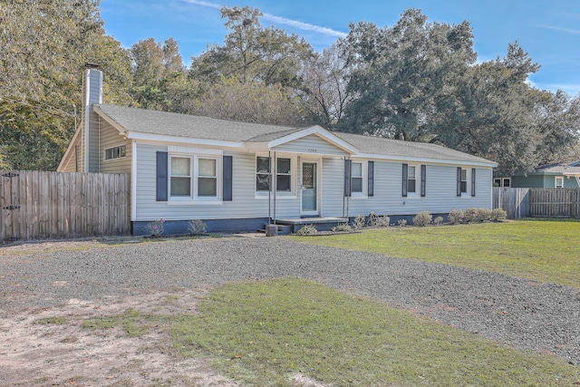 ranch-style home with a front lawn