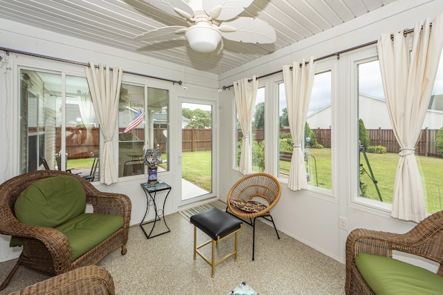 sunroom / solarium featuring ceiling fan