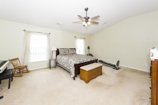 bedroom featuring ceiling fan, light carpet, and lofted ceiling