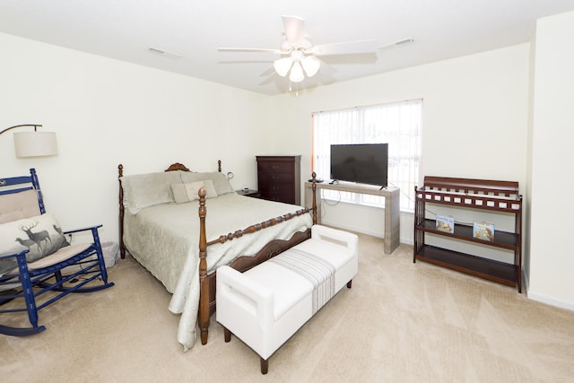 bedroom featuring light carpet and ceiling fan