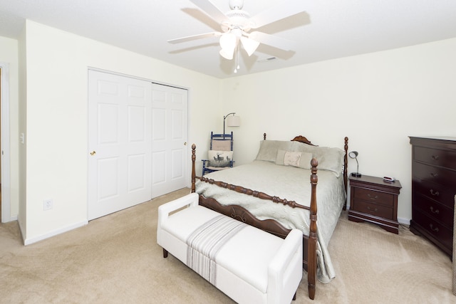 carpeted bedroom with a closet and ceiling fan