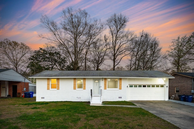 ranch-style house with crawl space, concrete driveway, a front lawn, and a garage