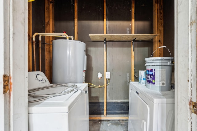 clothes washing area with electric water heater, washing machine and dryer, and laundry area