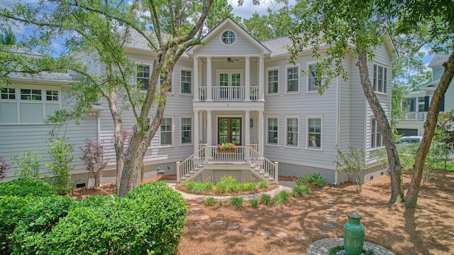 neoclassical / greek revival house with a porch, ceiling fan, and a balcony