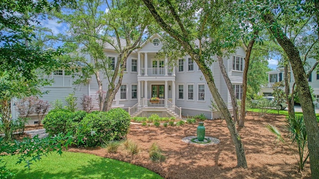 view of front of home with a balcony