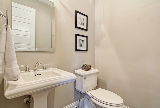 bathroom with toilet and sink