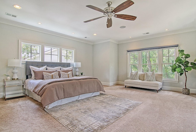 bedroom featuring crown molding, light colored carpet, and ceiling fan