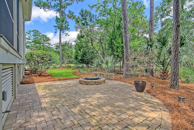 view of patio with an outdoor fire pit