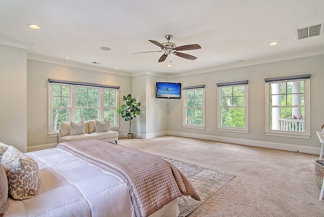 bedroom featuring ceiling fan, crown molding, and light carpet