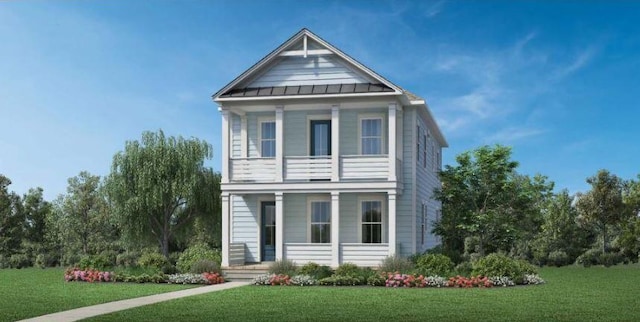view of front of property featuring covered porch, a standing seam roof, a front yard, and metal roof