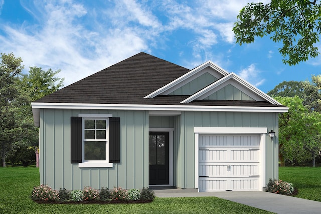 view of front of property featuring a garage and a front lawn