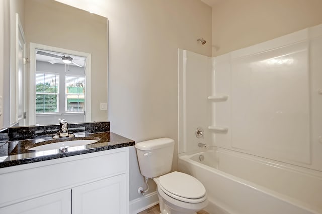 full bathroom with vanity, toilet, washtub / shower combination, and ceiling fan