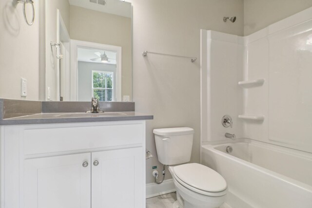 full bathroom featuring vanity, ceiling fan, toilet, and washtub / shower combination