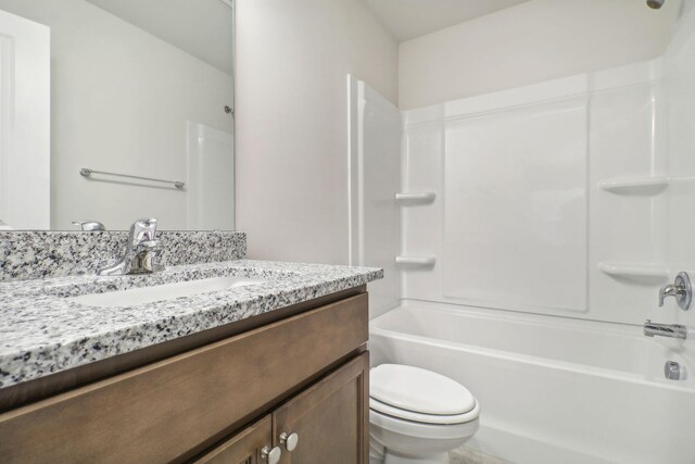 full bathroom with shower / bathtub combination, vanity, tile patterned flooring, and toilet