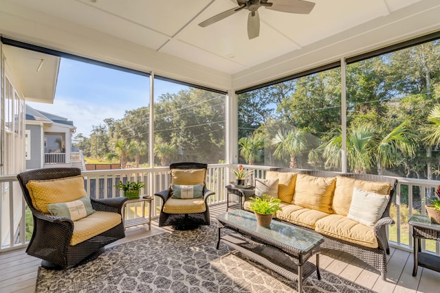 sunroom with ceiling fan and a wealth of natural light