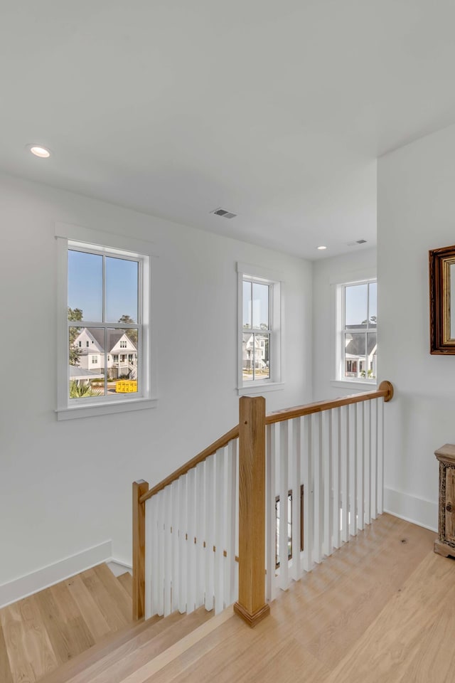 hall with light hardwood / wood-style flooring