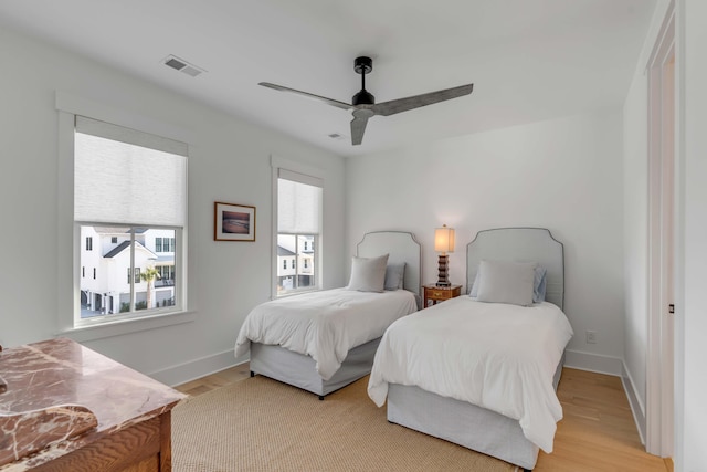 bedroom featuring light hardwood / wood-style floors and ceiling fan