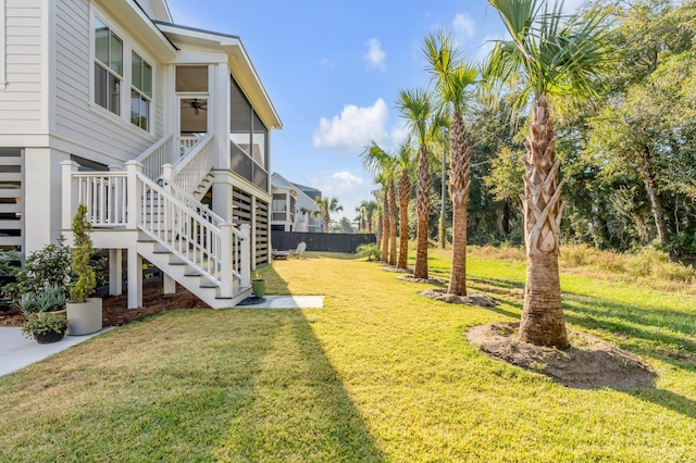 view of yard with a sunroom