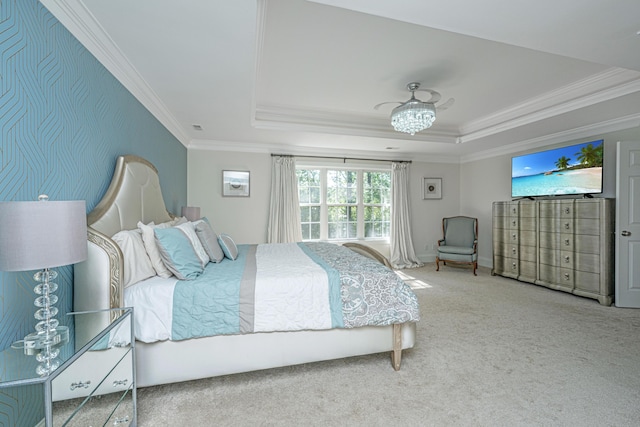 carpeted bedroom featuring crown molding and a raised ceiling