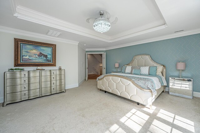 bedroom featuring crown molding, a chandelier, a tray ceiling, carpet floors, and baseboards