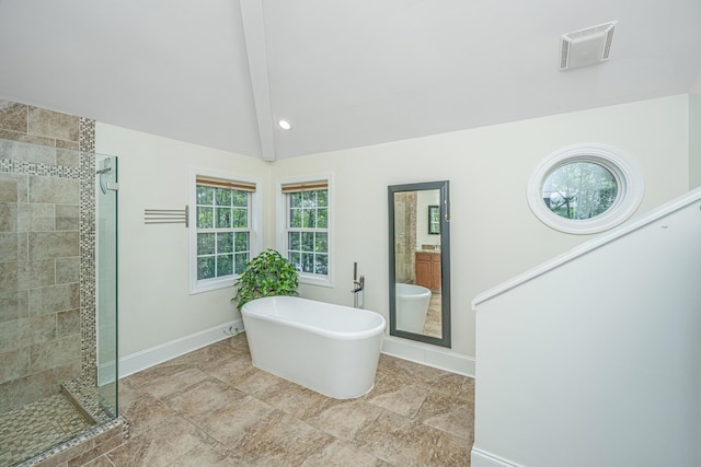 full bathroom featuring a shower stall, baseboards, and a freestanding bath
