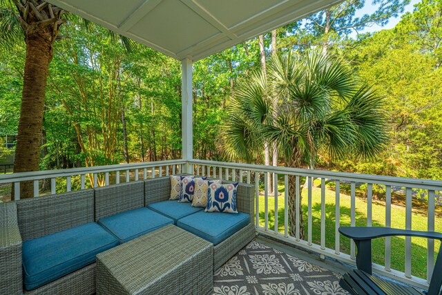 view of wooden balcony featuring an outdoor hangout area and a deck