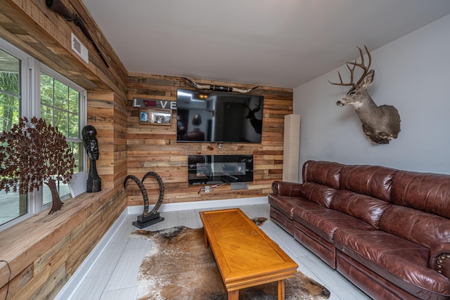 living room with wood walls