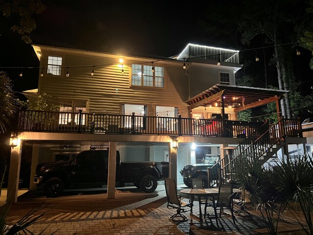 back of house at twilight with stairs
