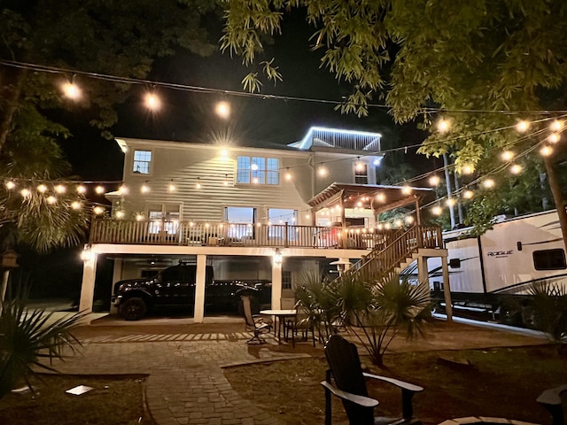 back of house at night featuring stairway