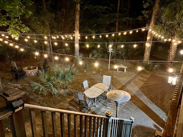 patio at twilight featuring outdoor dining space