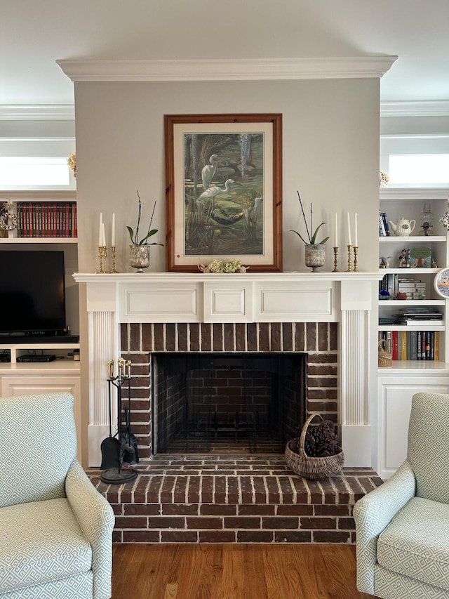 details with crown molding, wood finished floors, and a fireplace