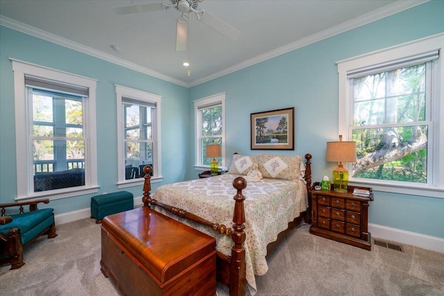 carpeted bedroom featuring baseboards, visible vents, and multiple windows