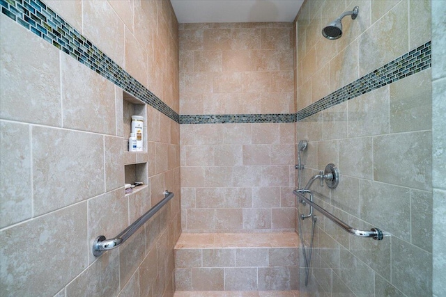 bathroom with tiled shower