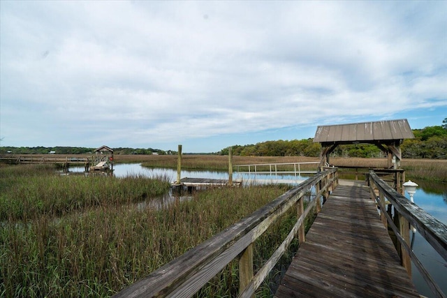 dock area featuring a gazebo and a water view