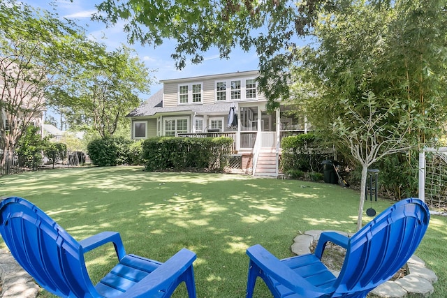 exterior space with a yard and roof with shingles