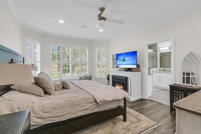 bedroom featuring ceiling fan, crown molding, wood finished floors, connected bathroom, and recessed lighting