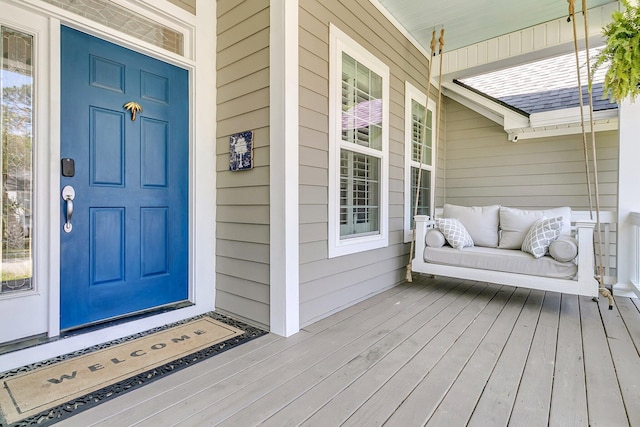 entrance to property featuring covered porch