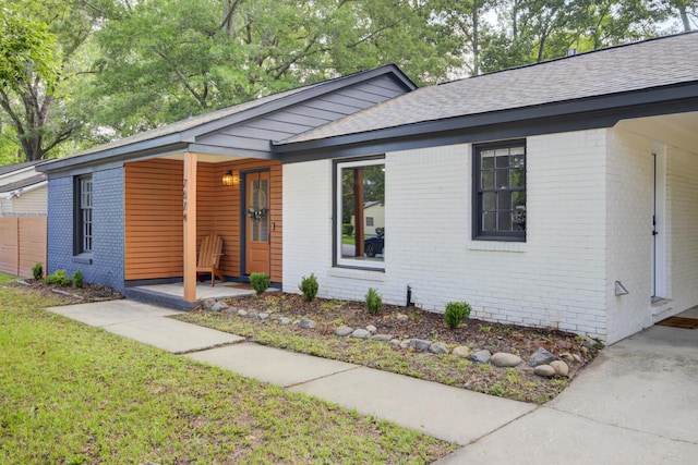7674 Chippendale Rd, North Charleston, SC 29420 - ranch-style house with brick siding, a shingled roof, and a front yard