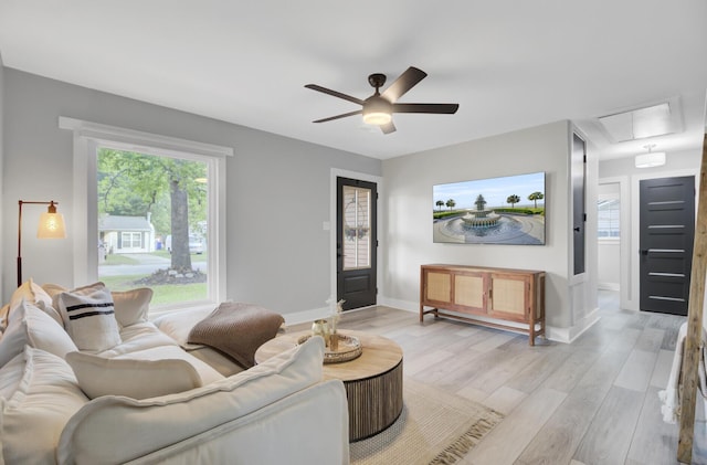 7674 Chippendale Rd, North Charleston, SC 29420 - living room featuring attic access, a ceiling fan, light wood-style flooring, and baseboards