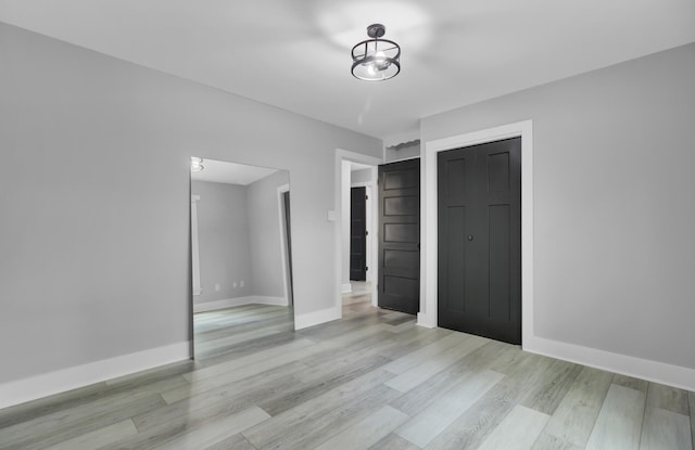 7674 Chippendale Rd, North Charleston, SC 29420 - unfurnished bedroom featuring light wood-style floors, baseboards, and a closet