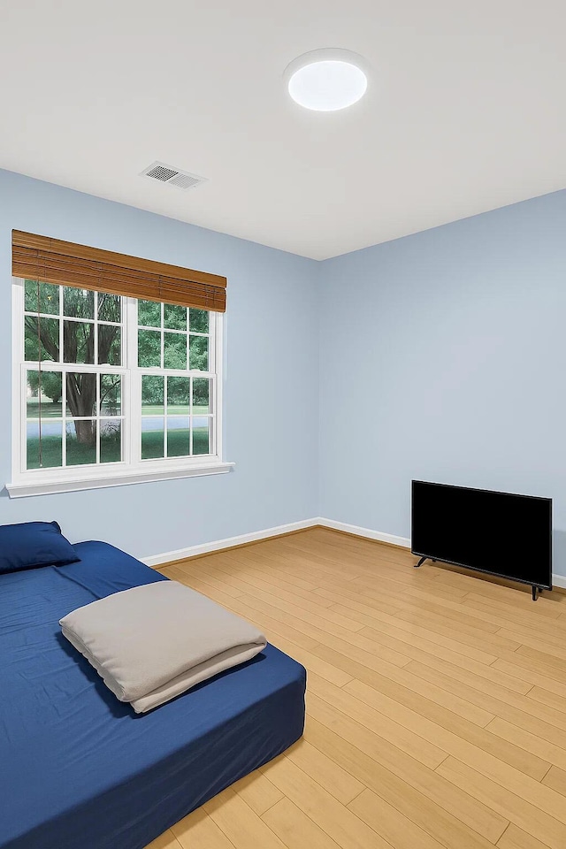 1309 Llewellyn Rd, Mount Pleasant, SC 29464 - unfurnished bedroom with light wood-style flooring and baseboards