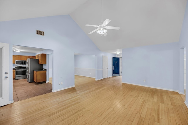 1309 Llewellyn Rd, Mount Pleasant, SC 29464 - unfurnished living room with high vaulted ceiling, a ceiling fan, light wood-type flooring, and baseboards