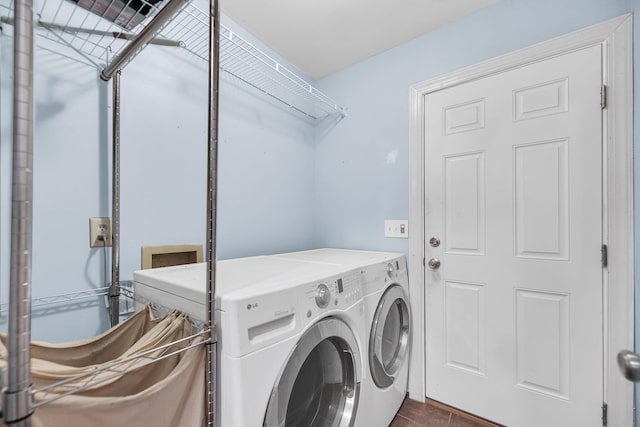 1309 Llewellyn Rd, Mount Pleasant, SC 29464 - washroom featuring washing machine and dryer and dark tile patterned floors